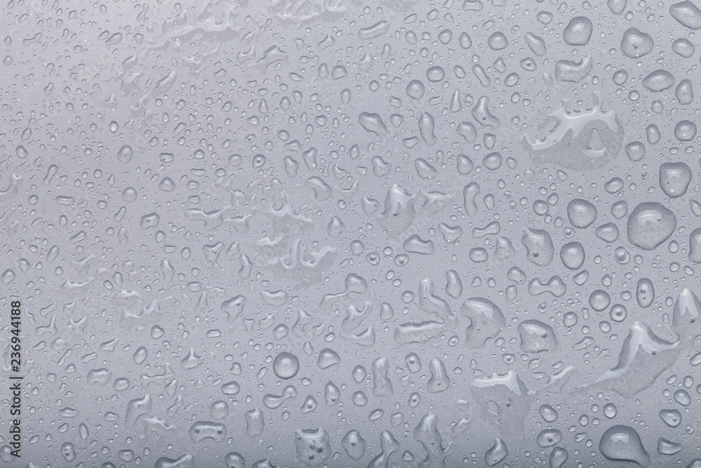 Drops of water on a color background. Gray. Selective focus Drops of water on a color background. Gray. Selective focus