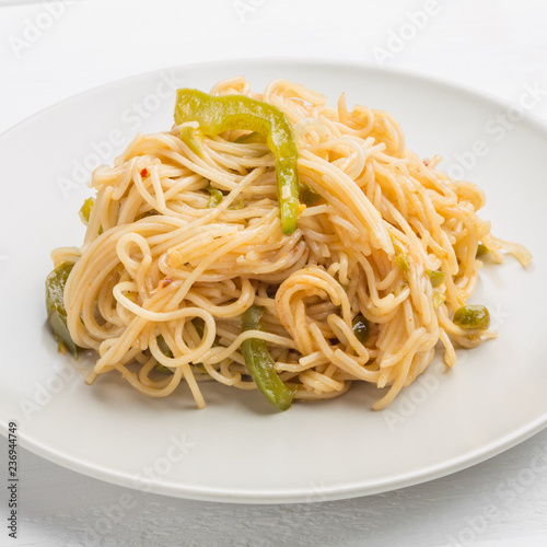 Noodles with bell pepper on plate