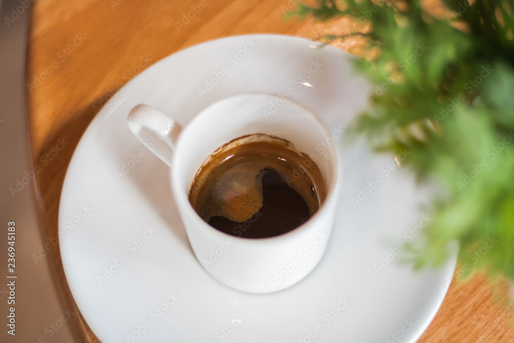 Coffee and green leave on wooden floor. Coffee and green leave on wooden floor.