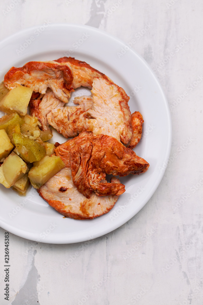 grilled turkey with vegetables on white plate grilled turkey with vegetables on white plate