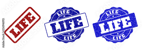 LIFE grunge stamp seals in red and blue colors. Vector LIFE overlays with grunge effect. Graphic elements are rounded rectangles, rosettes, circles and text labels.