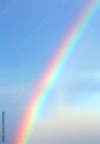 Bright rainbow in the blue sky