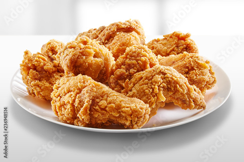 crispy coated batter southern style fried chicken in a wooden table