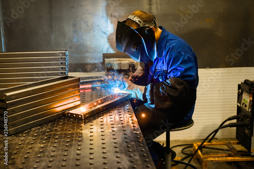 Photos Working welder welds parts factory