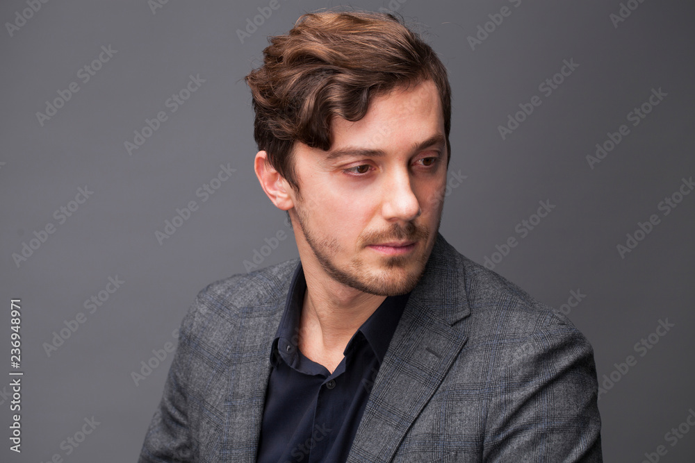 Studio portrait of young man on a dark background Studio portrait of young man on a dark background
