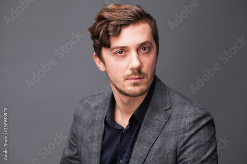 Studio portrait of young man on a dark background