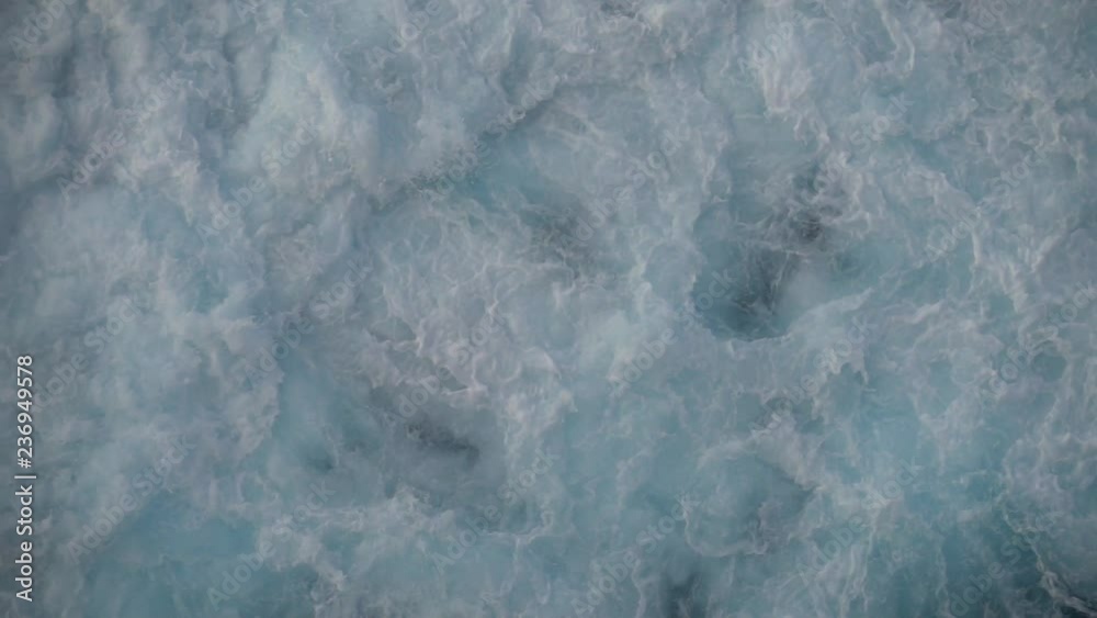 The white wake of a boat in the water The white wake of a boat in the water