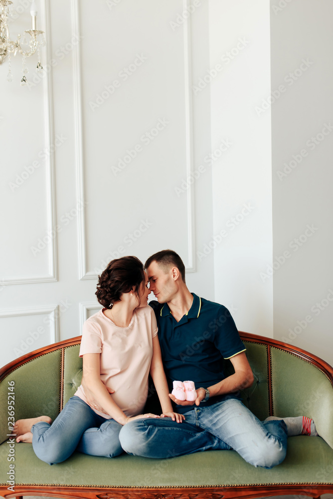 young married couple waiting for a miracle, pregnant wife with her husband young married couple waiting for a miracle, pregnant wife with her husband