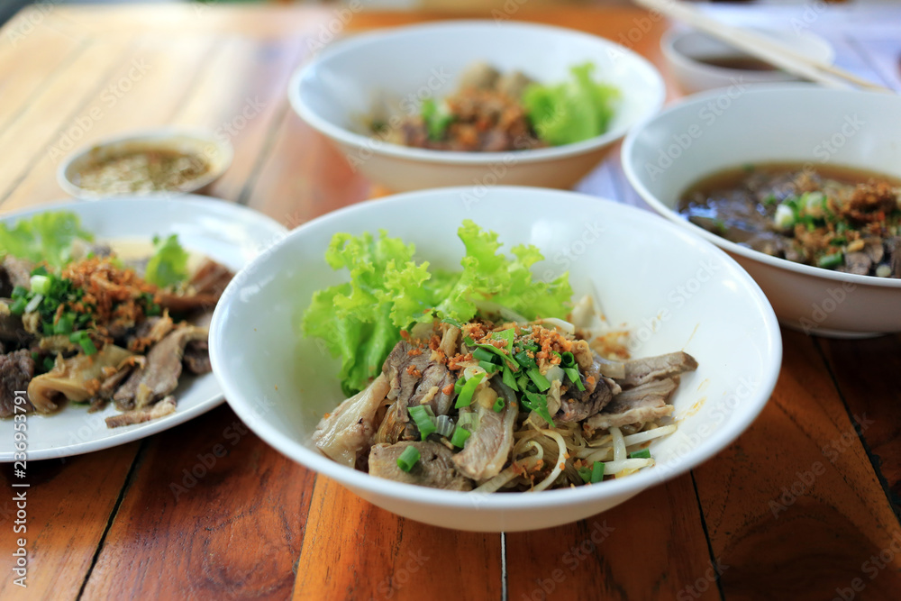Dry noodle stewed beef with vegetable Thai local street food.
