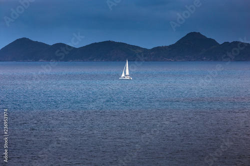 Sailing ship yacht with white sails in the open sea