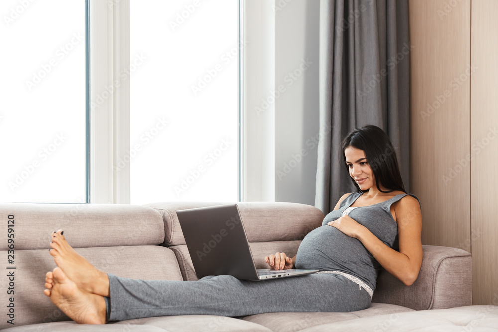 Beautiful young pregnant woman at home Beautiful young pregnant woman at home