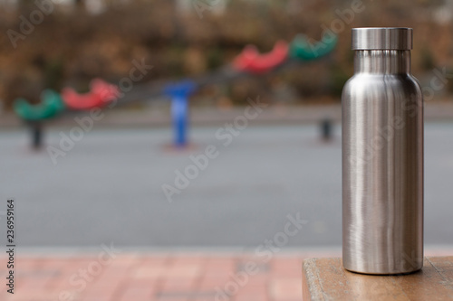 Insulated Stainless Bottle with a children´s playground in winter background