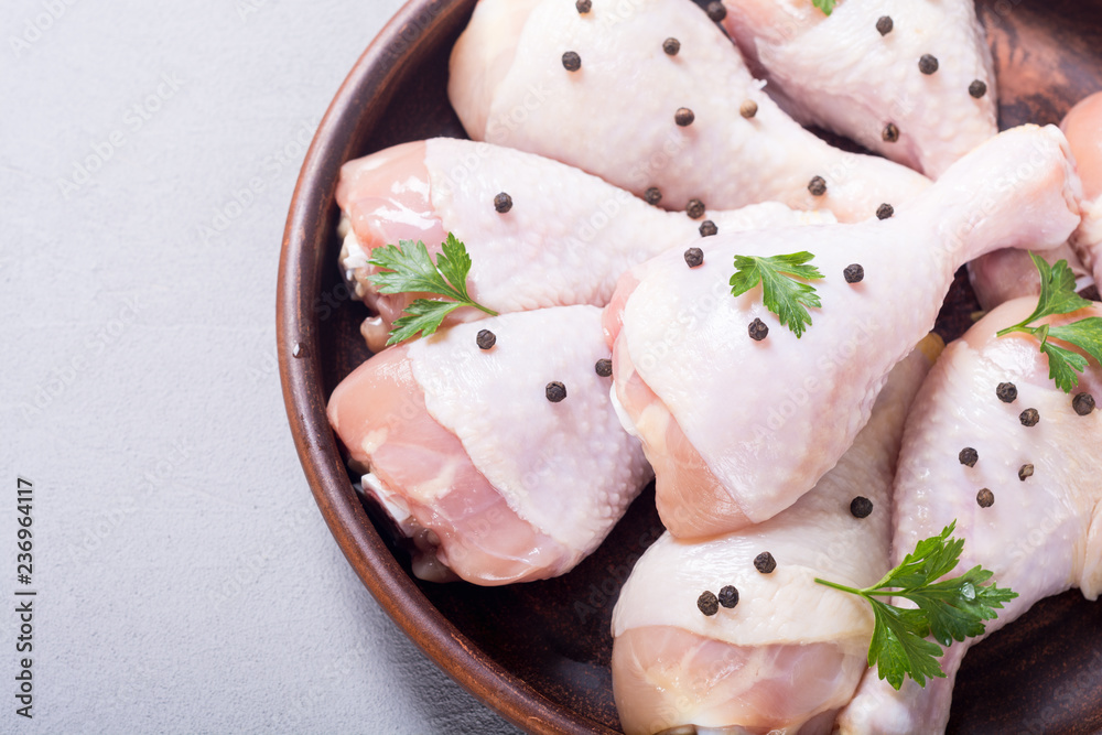 Raw chicken legs with spices and parsley. Food background Raw chicken legs with spices and parsley. Food background