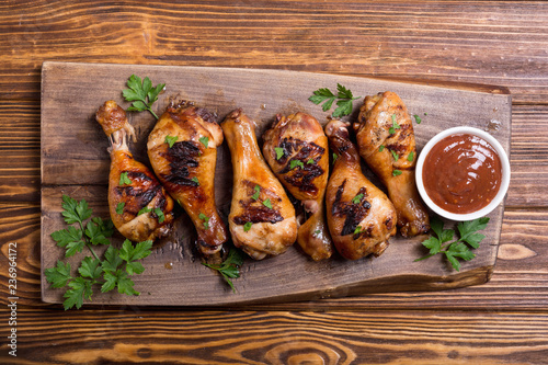 Grilled chicken legs with tomato sauce BBQ food background