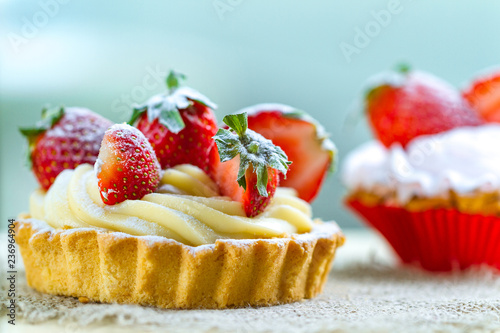 Tasty strawberry cake with whipped cream and with fresh strawberries. Pastry. Sweet dessert