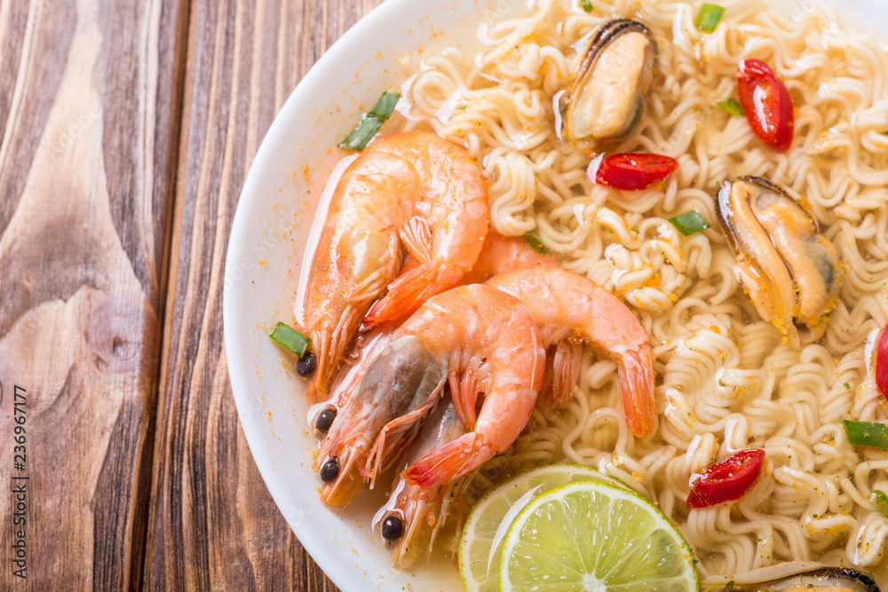 Instant noodles soup with shrimps and mssels . Asian food Instant noodles soup with shrimps and mssels . Asian food