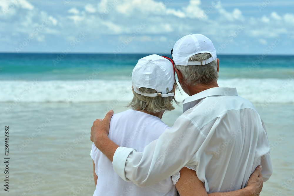 Portrait of elderly couple on a beach