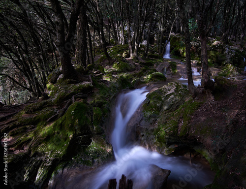 Natural waterfall of water in mediterranean forest. Spain. Balearic Islands