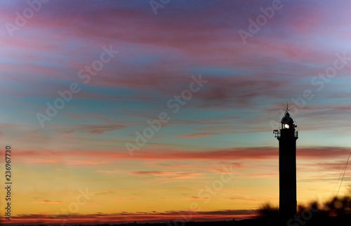 Lighthouse at sunset under a splendid sky of colors . Mediterranean sea in Spain. Baleares, Mallorca