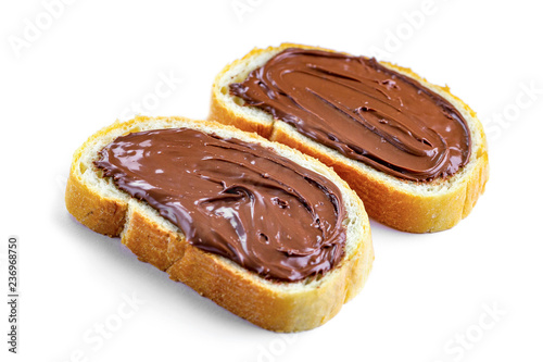 Fotografie, Obraz Isolated pieces of loaf with chocolate paste spread on a white background