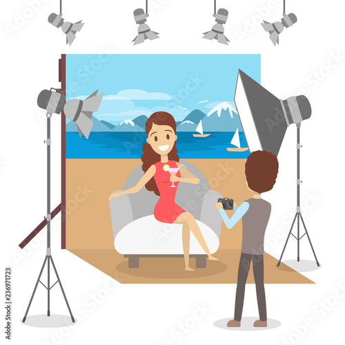 Beautiful woman in red dress making photoshoot