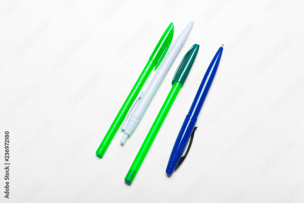 different colors pens isolated on the white background