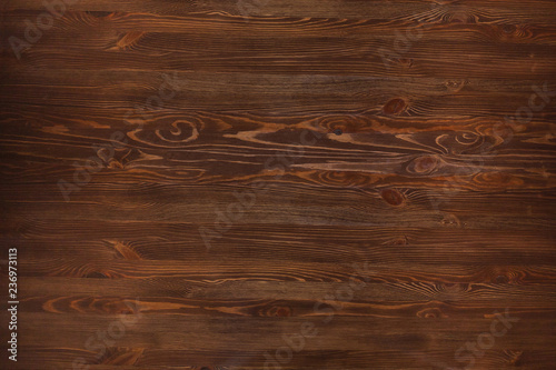 Texture of brown wood. Table texture from a restaurant or bar. Natural wood texture.