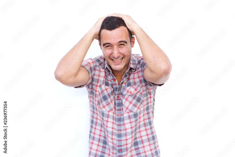 older happy man laughing with hands behind head against isolated white background older happy man laughing with hands behind head against isolated white background