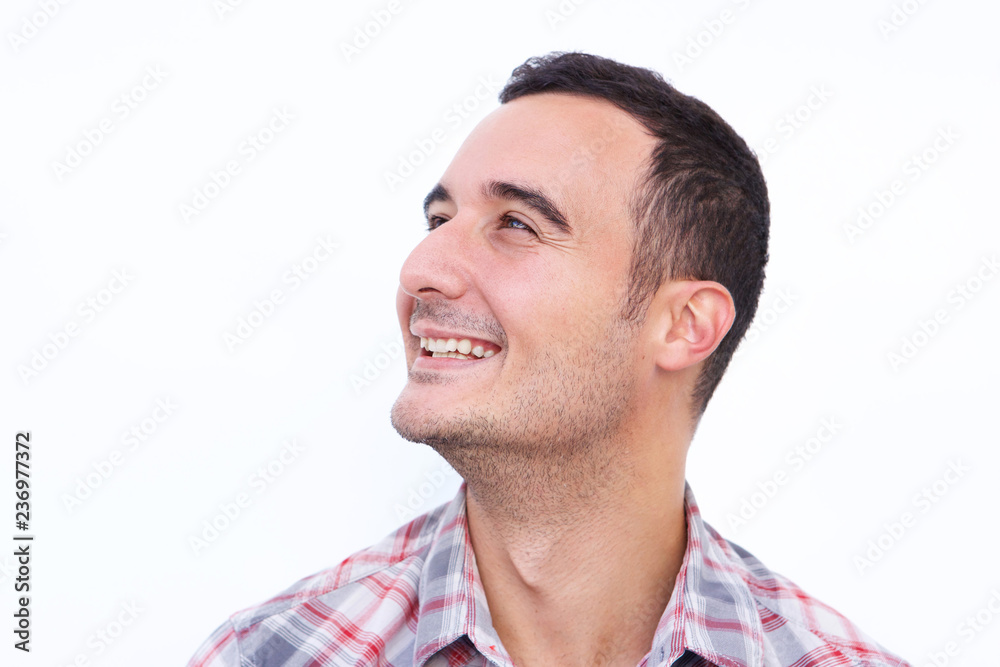 Fototapeta premium Close up happy latin man looking away against isolated white background