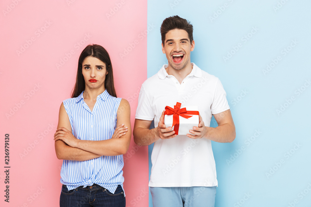 Happy young couple standing isolated Happy young couple standing isolated