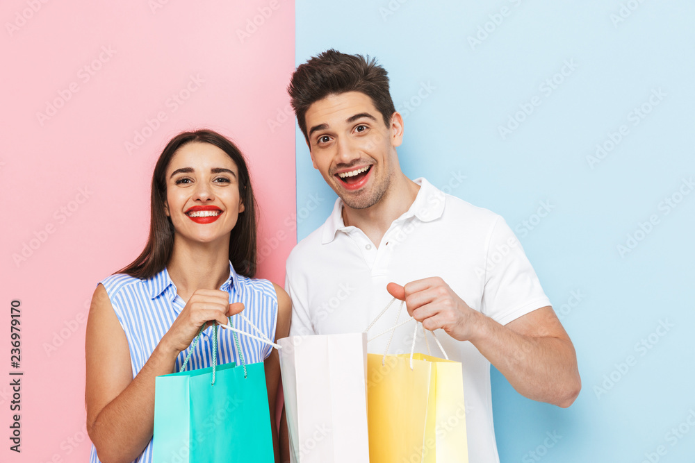 Happy young couple standing isolated Happy young couple standing isolated