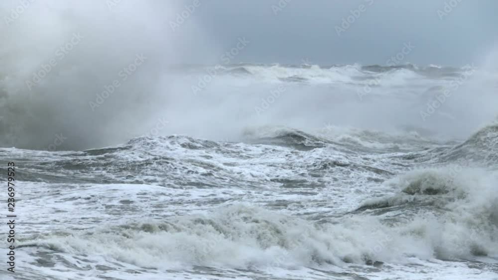 High wave breaking on the rocks of the coastline. Extremely Big Wave crushing coast , Large Ocean Beautiful Wave. Super Slow Motion.. High wave breaking on the rocks of the coastline. Extremely Big Wave crushing coast , Large Ocean Beautiful Wave. Super Slow Motion..
