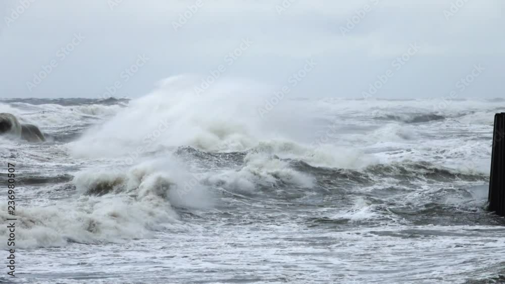 High wave breaking on the rocks of the coastline. Extremely Big Wave crushing coast , Large Ocean Beautiful Wave. Super Slow Motion.. High wave breaking on the rocks of the coastline. Extremely Big Wave crushing coast , Large Ocean Beautiful Wave. Super Slow Motion..