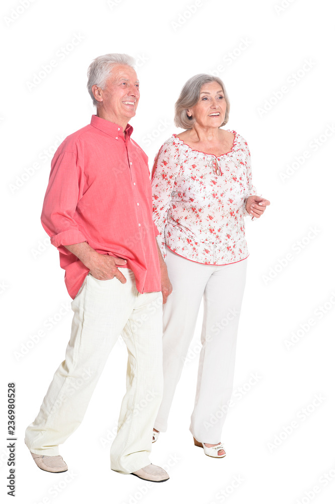 Portrait of senior couple holding hands on white background, full length Portrait of senior couple holding hands on white background, full length