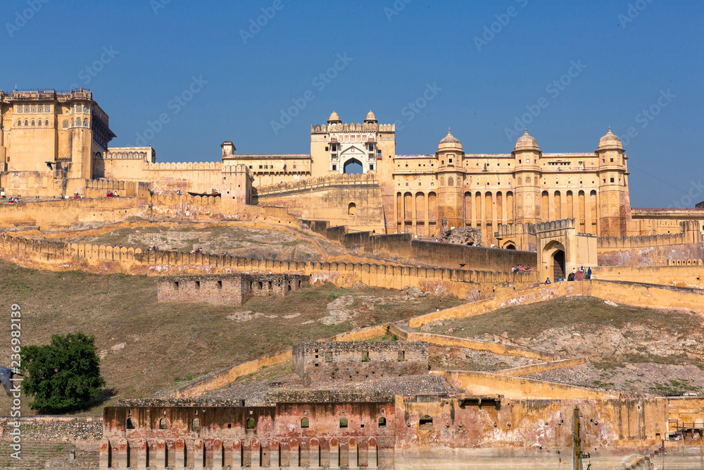 Amber Fort illuminated by warm light of the rising sun. Famous Indian landmark located nearby Jaipur city in Rajasthan, India