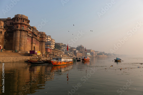 Morning view of Ganges river in Varanasi, India. Ghats with boats and people. Popular landmark