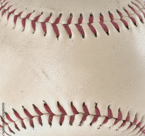 Close-up image of used baseball showing wear