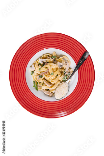 Pasta with white mushrooms and cream sauce. Tagliateli Italian cuisine. Free space for your text. Top view white background photo