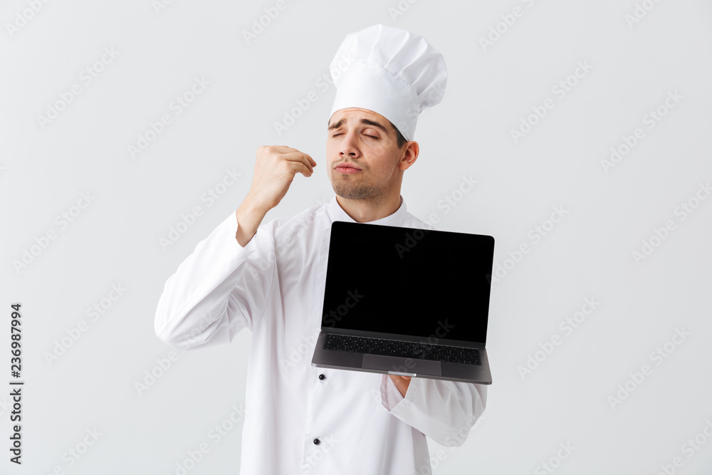 Cheerful chef cook wearing uniform Cheerful chef cook wearing uniform