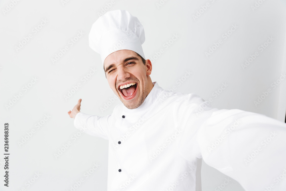 Happy chef cook wearing uniform standing Happy chef cook wearing uniform standing
