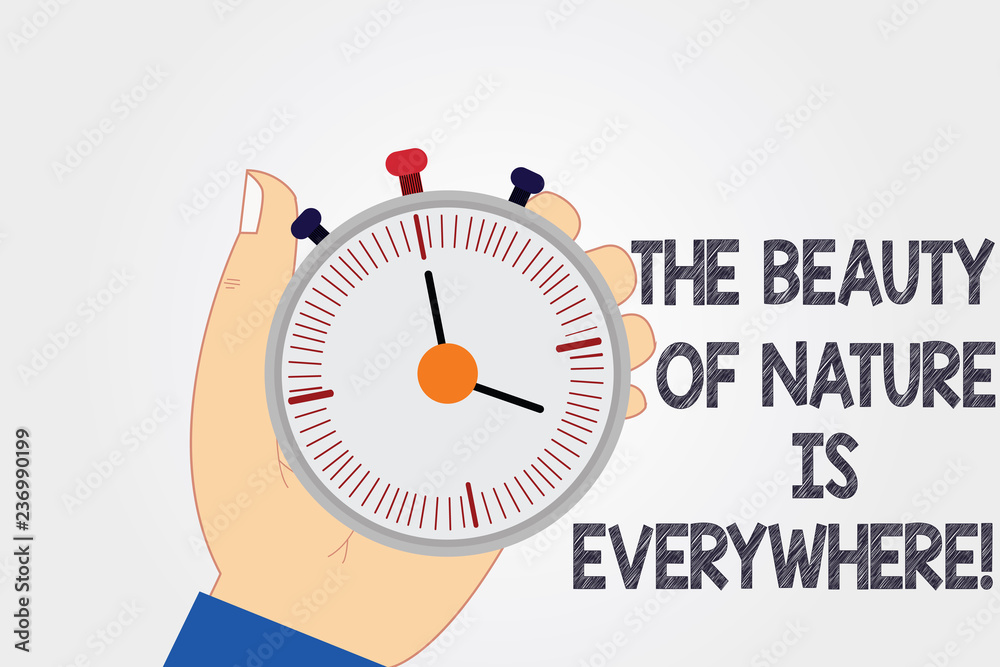 Naklejka premium Handwriting text writing The Beauty Of Nature Is Everywhere. Concept meaning Natural scenes are in all the places Hu analysis Hand Holding Mechanical Stop Watch Timer with Start Stop Button