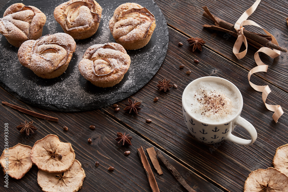 notebook, muffins on black plate, notepad, cappuccino cup notebook, muffins on black plate, notepad, cappuccino cup