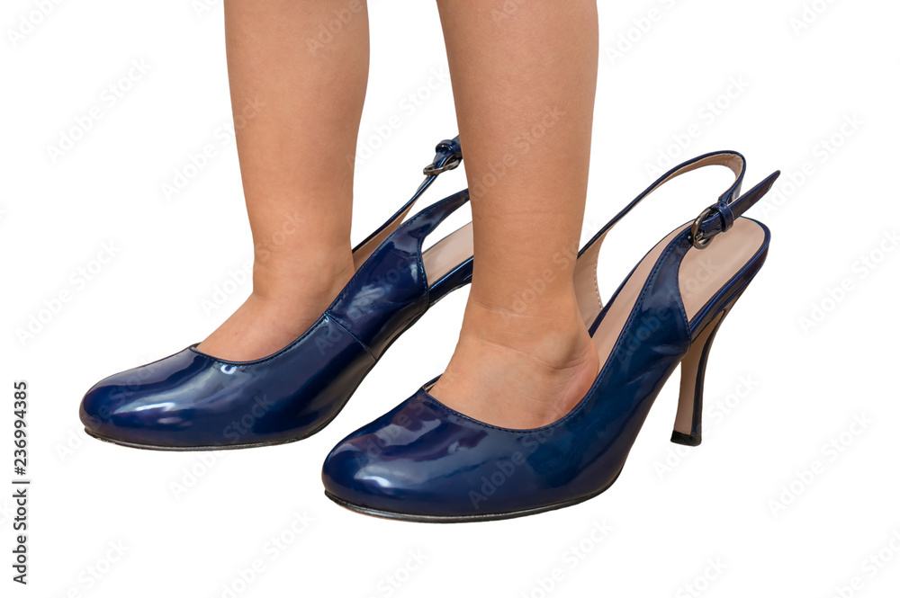 Small child is trying to put on mother's shoes Small child is trying to put on mother's shoes