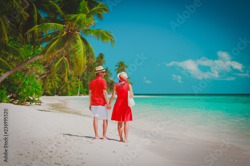 happy loving couple walk on beach, romantic vacation