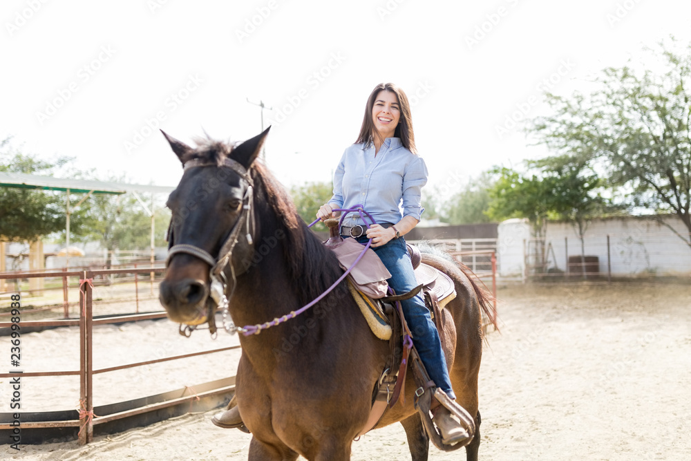 Rancher Smiling While Riding Brown Horse Rancher Smiling While Riding Brown Horse
