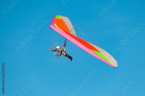  Hang glider pilot fly his bright kite wing photo