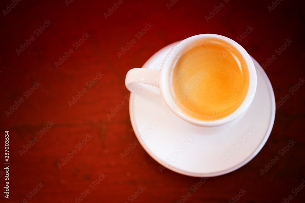 cup of fresh coffee on wooden table cup of fresh coffee on wooden table