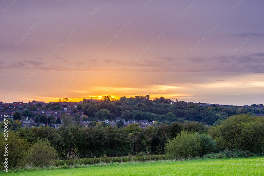 Sunset over the field and village