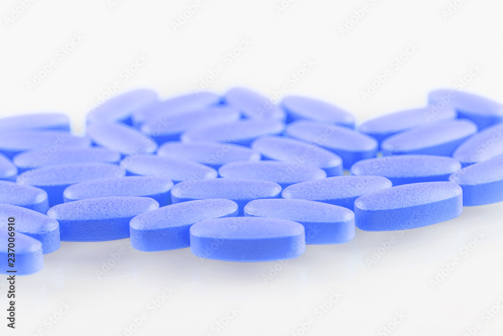 blue pills on a white background