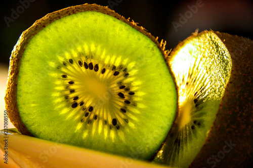 slice of kiwi on white background